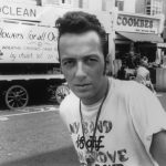 SLUG: ST/APPREC DATE: 12/23/02 SOURCE: file photo by Josh Cheuse, courtesy of Epic Records. CAPTION: Undated file photo of punk rock great Joe Strummer of The Clash. Strummer died Sunday, Dec. 22, 2002, reportedly of a heart attack.